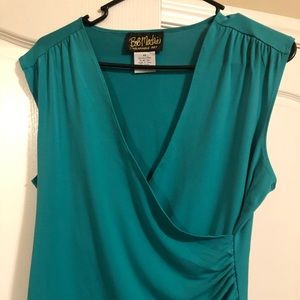 Green sleeveless blouse